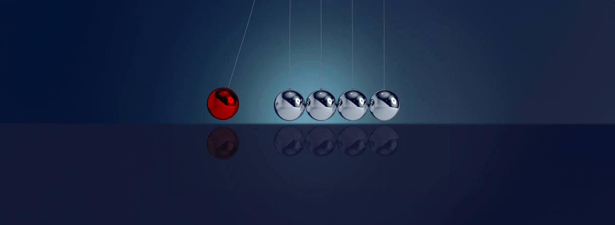 A group of balls hanging from strings on a background.